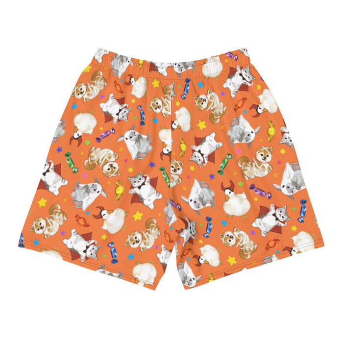 Trick or Treaters alternative men's athletic shorts in pumpkin orange with mummy puppies and wrapped candy